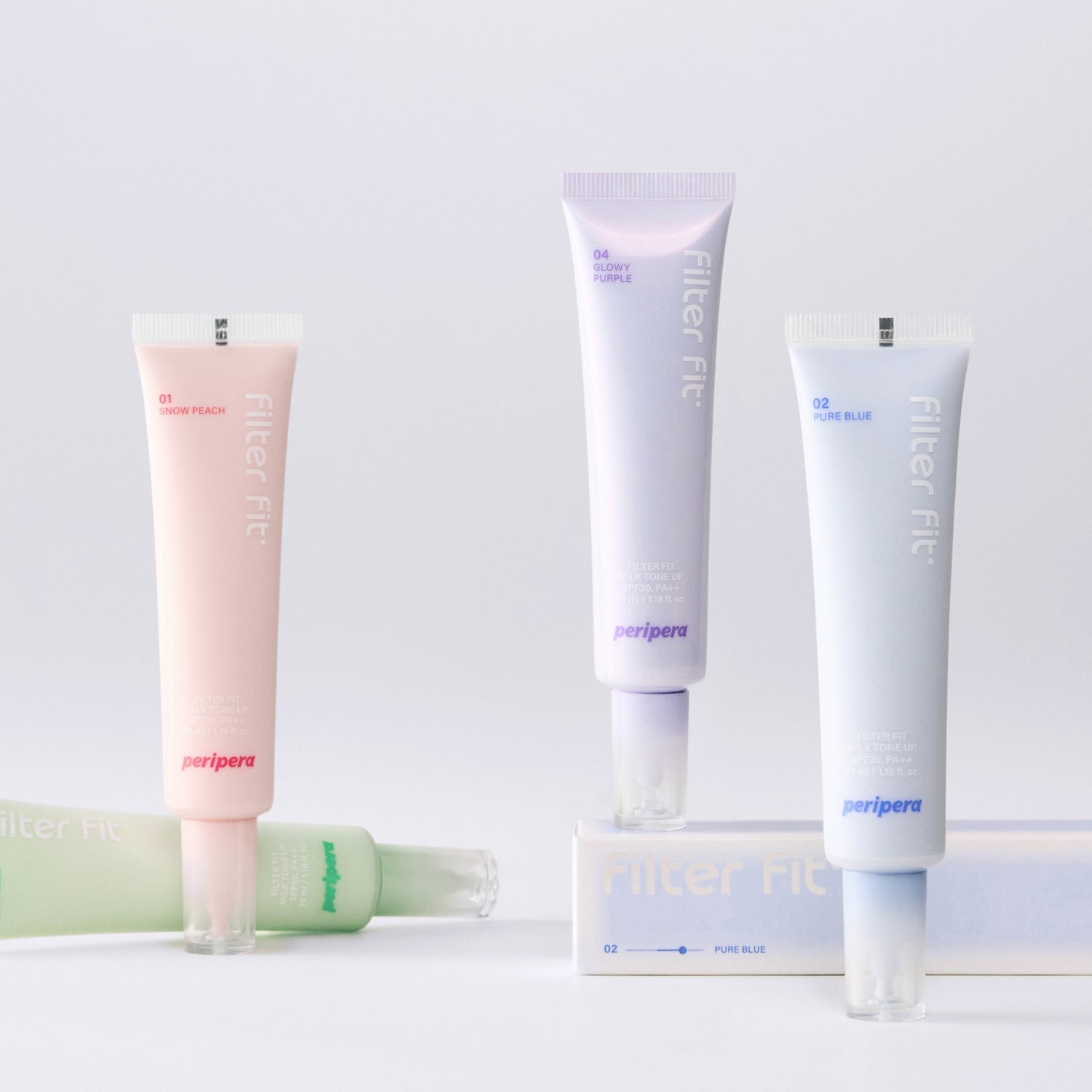 Peripera Filter Fit Milk Tone Up tone-up cream jar with white and pastel packaging, showcasing smooth, creamy texture and branding.