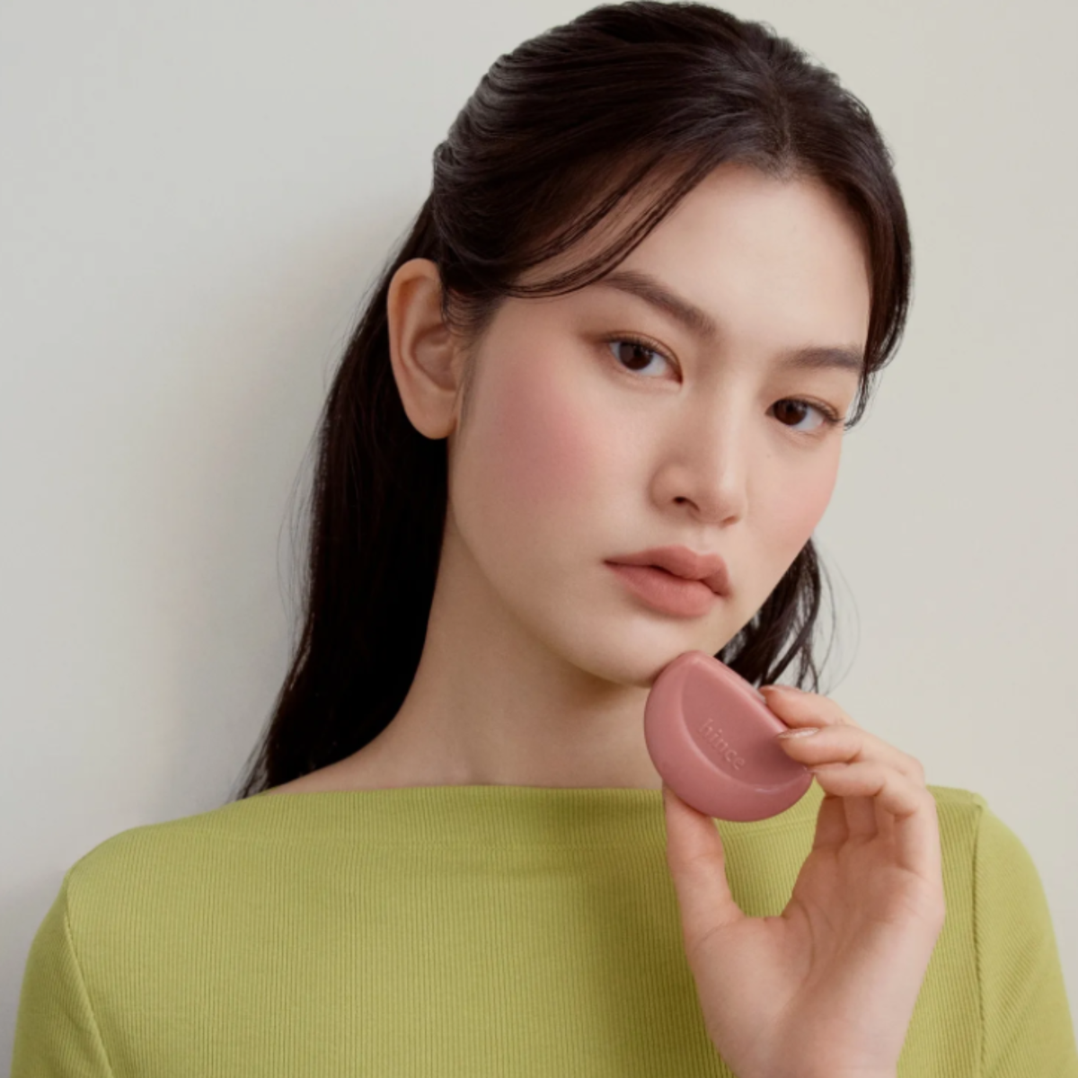 Hince Half-Moon Cheek Cream to Powder Blush in a compact with soft pink shade and sleek packaging, designed for a natural flush.