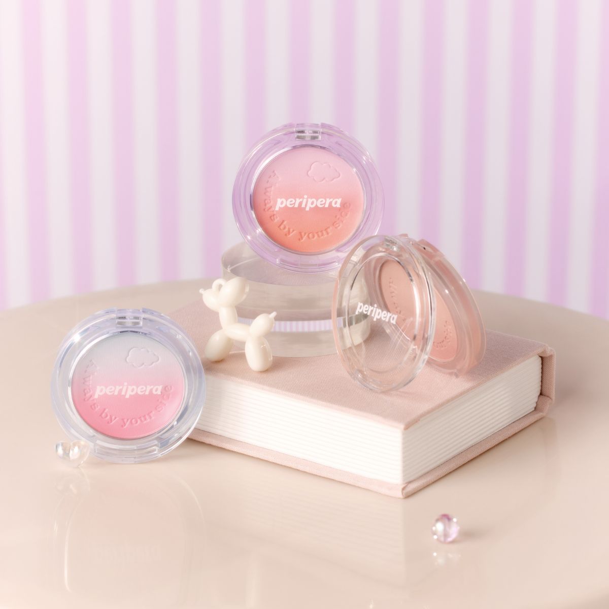 Peripera Pure Blushed Custom Cheek blush in soft pink shade, showing the compact with blush inside and a fluffy brush applicator
