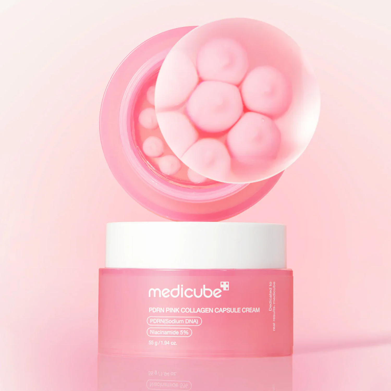 Medicube PDRN Pink Collagen Capsule Cream face moisturizer jar with pink lid and label, showing the 55g container.