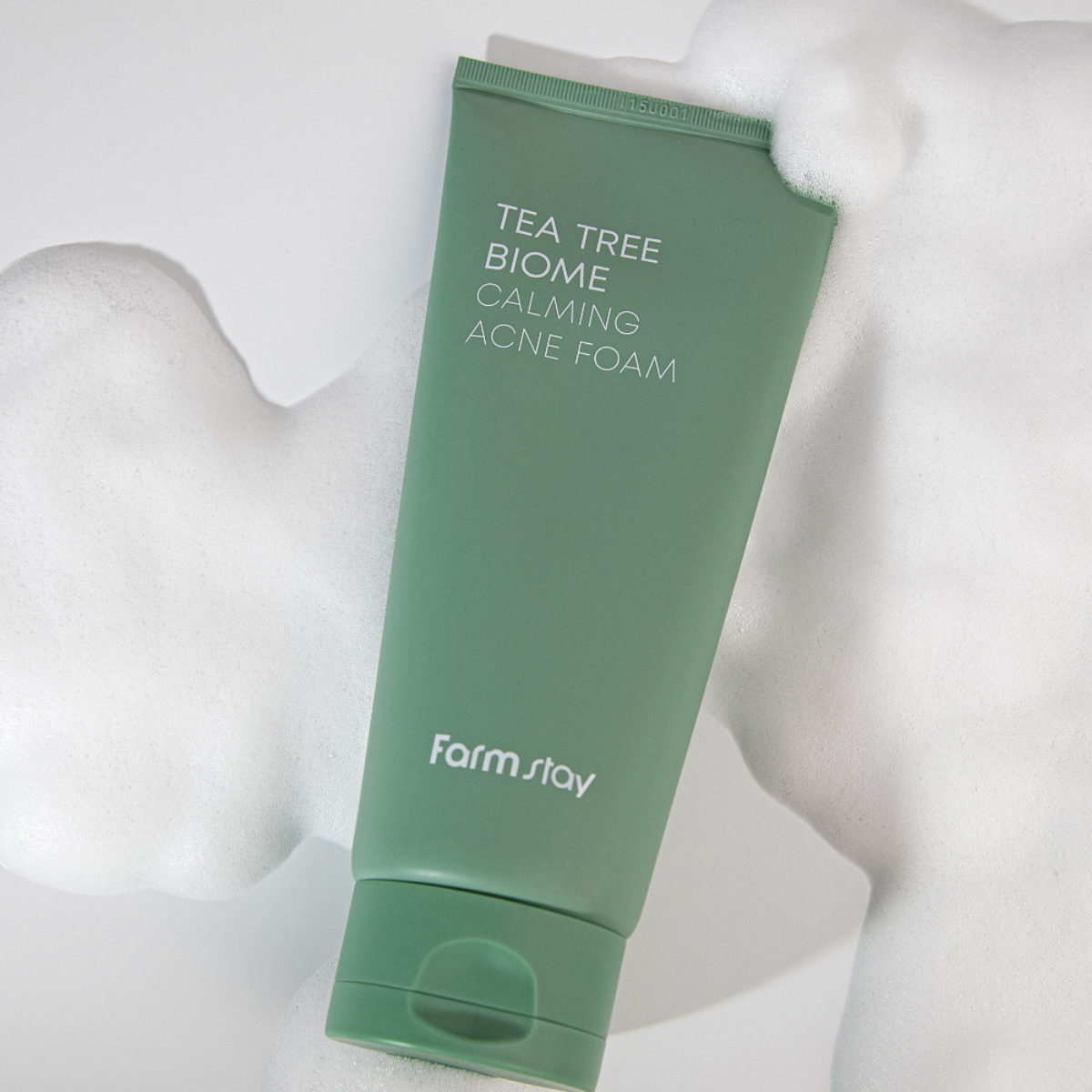 Farmstay Tea Tree Biome Calming Acne Foam in a 180ml bottle, showing the gel and foam cleanser with a natural, calming design.