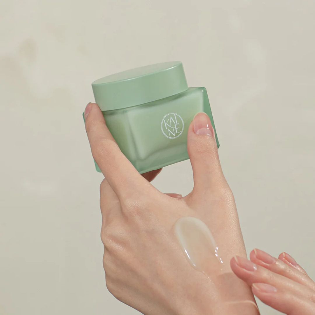 Green Calm Aqua Cream by KAINE, 70ml face moisturizer in a green jar, designed for hydrating and soothing skin.