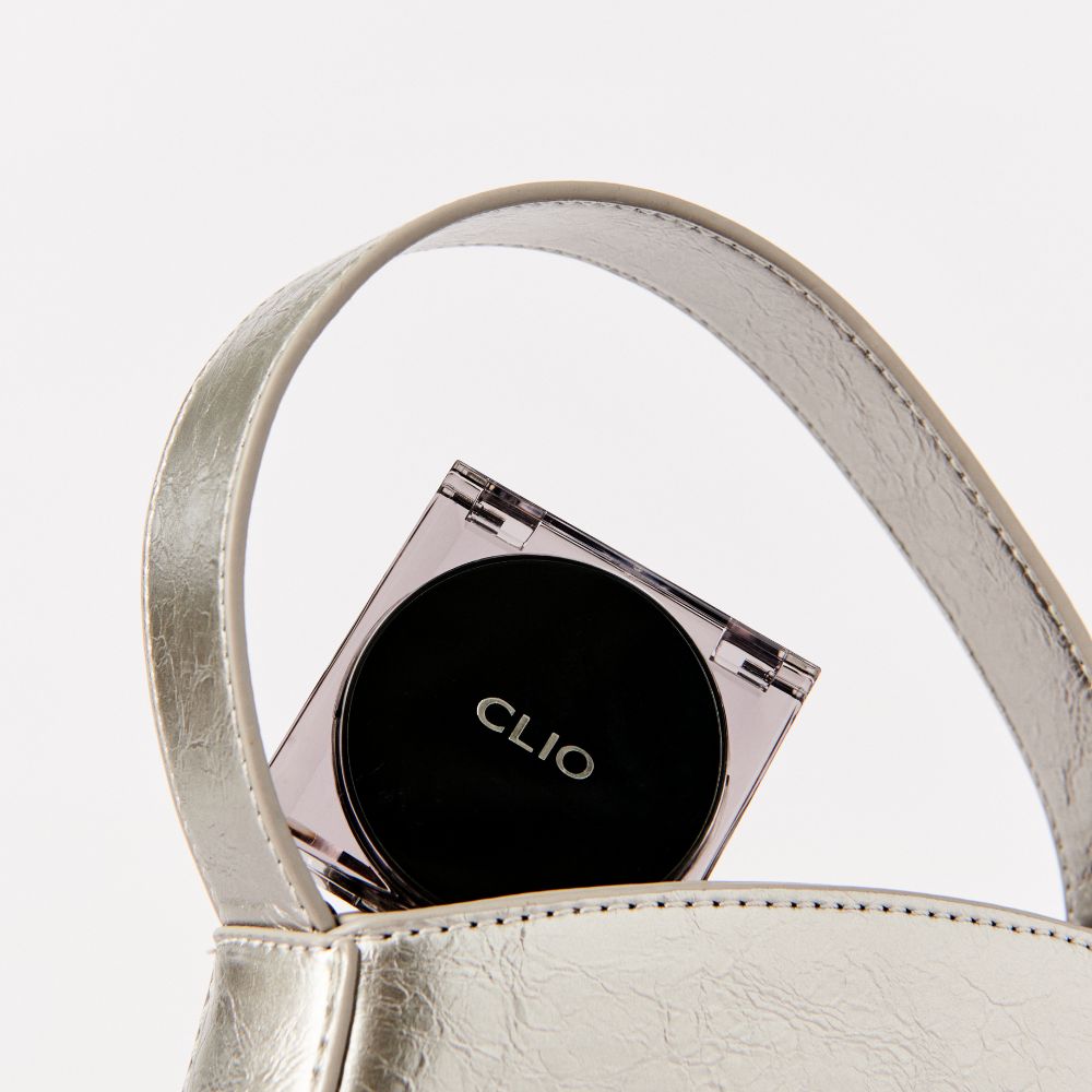 Clio Kill Cover The New Foundwear Cushion Mini foundation compact with open mirror and cushion applicator on a white background.