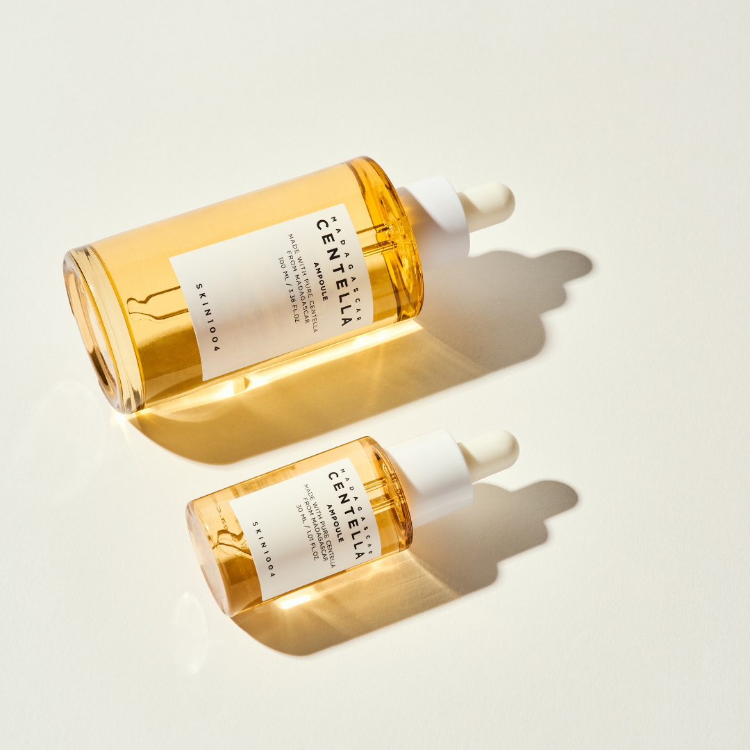 SKIN1004 Madagascar Centella Ampoule in a clear glass bottle with a white pump dispenser, showing the product label on the front.