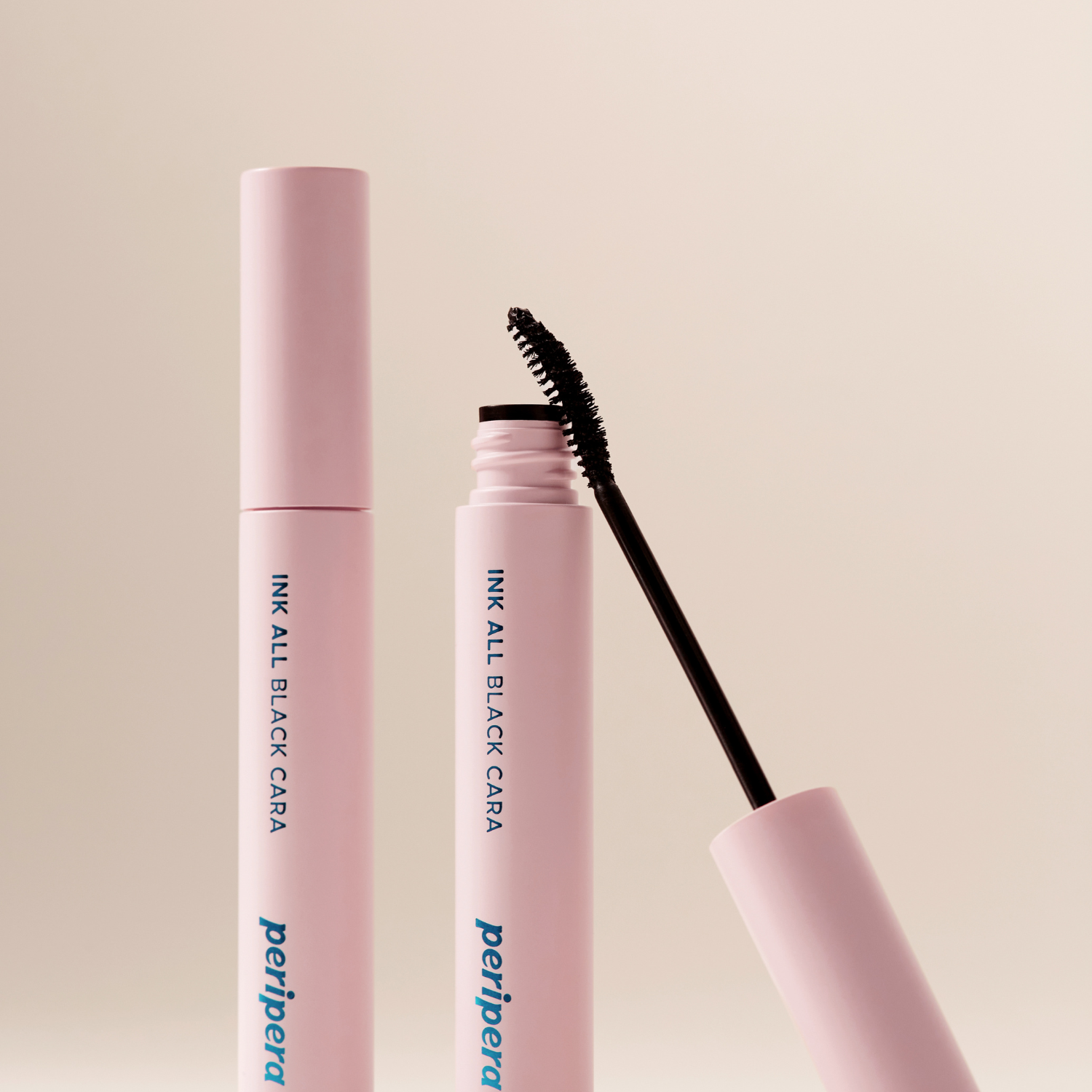 Peripera Ink All Black Cara mascara wand with black mascara formula and textured brush for voluminous eyelashes.