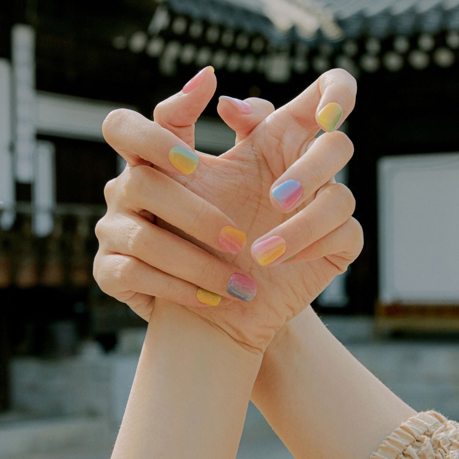Semi-cured gel nail in pastel shade with Ohora branding, showcasing a smooth, glossy finish on natural nails.