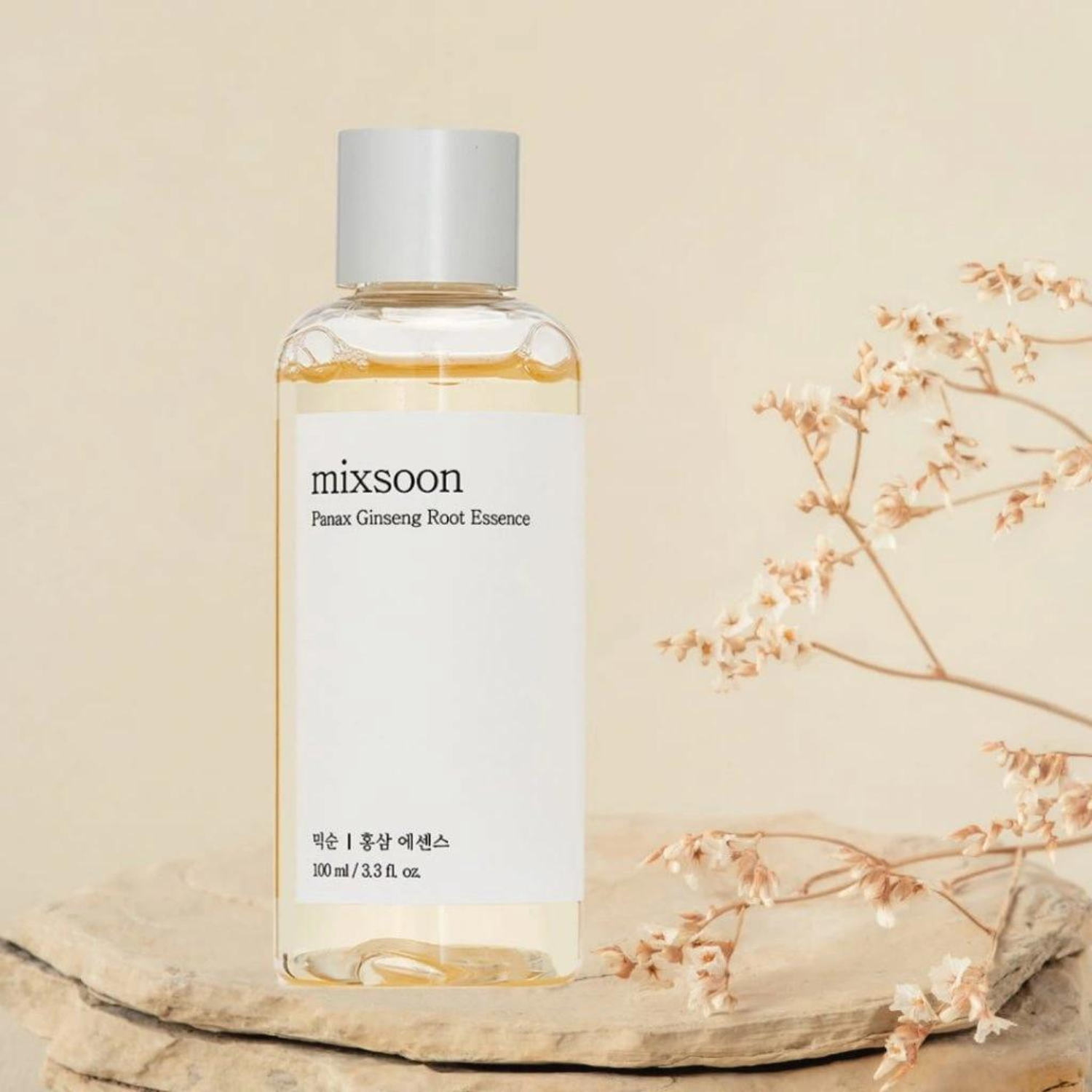 Bottle of Mixsoon Panax Ginseng Root Essence 100ml with ginseng root illustration on label.