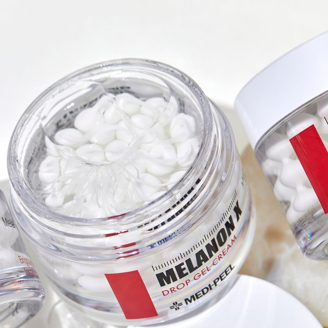 MEDIPEEL+ Melanon X Drop Gel Cream 50g face moisturizer in a clear tube, showing smooth gel texture and bright packaging.