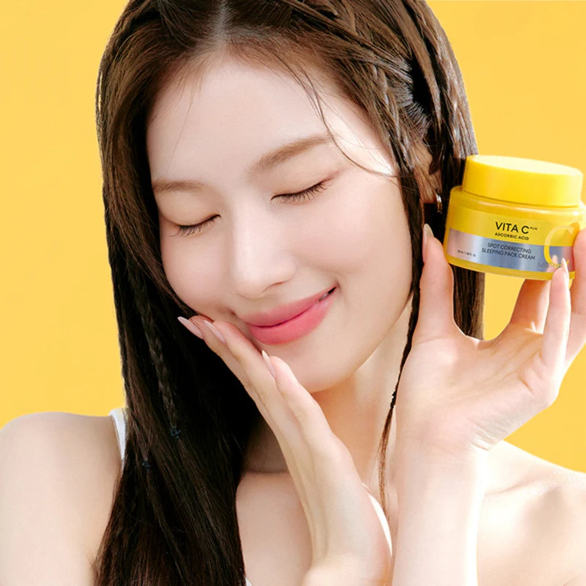 Missha Vita C Plus Spot Correcting Sleeping Mask pack in a 50ml jar, showing the cream texture and packaging.