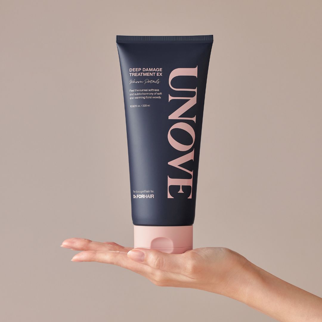 UNOVE Deep Damage Treatment EX conditioner in Warm Petal scent, showing a 320ml bottle with a sleek design and vibrant label.