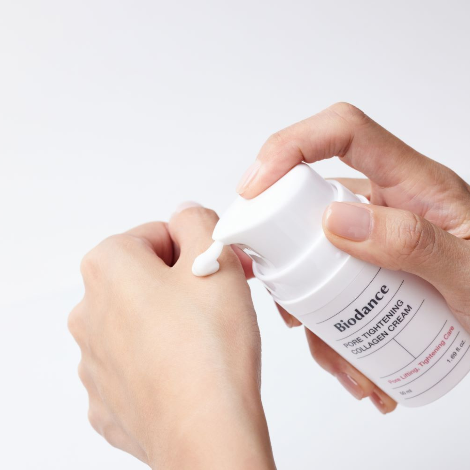 Biodance pore tightening collagen face moisturizer in a 50ml jar, showing the cream's smooth texture and packaging.