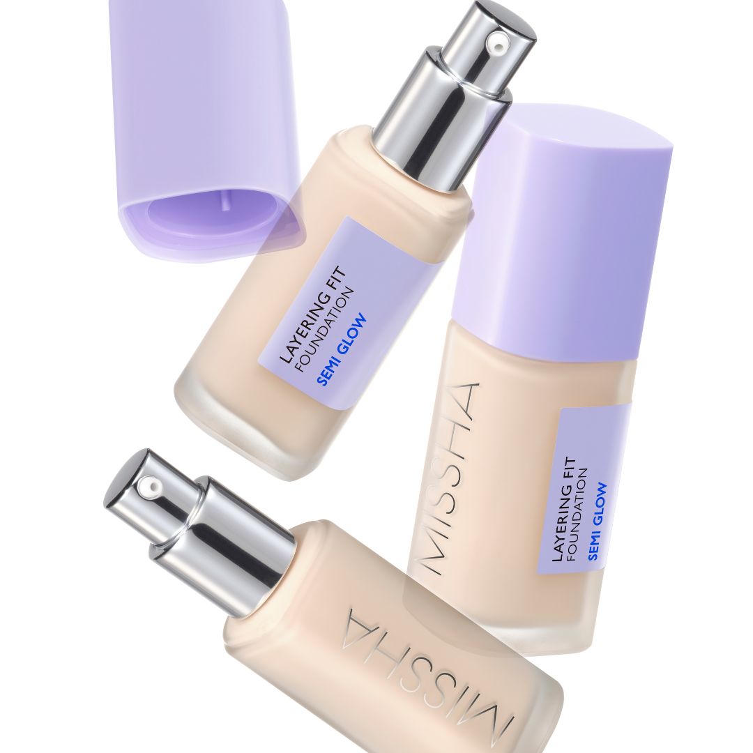 Missha Layering Fit Foundation Semi Glow liquid foundation in a sleek bottle with a pump dispenser, showing the product label.