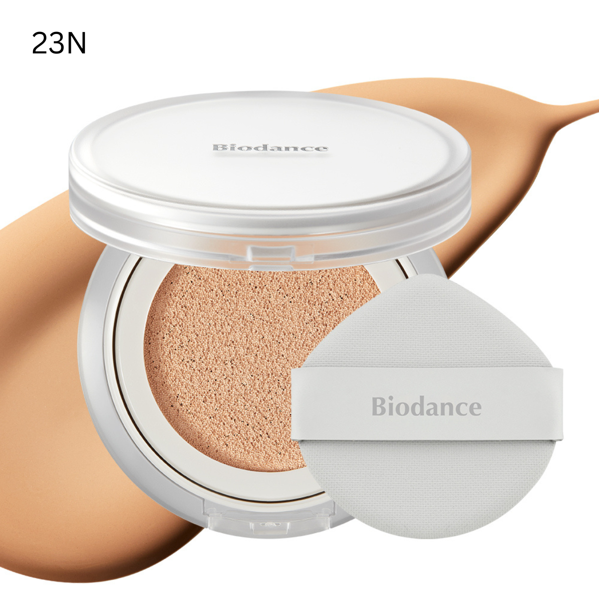 Biodance Radiant Pure Essence Cushion foundation compact with beige sponge applicator and closed lid, showing the product packaging.