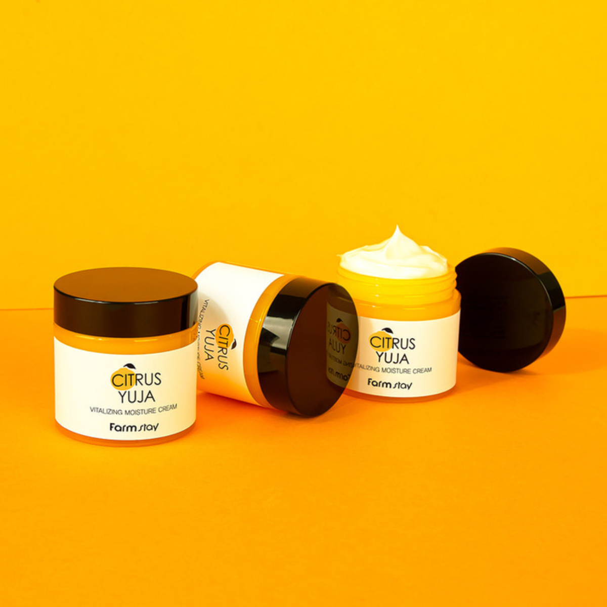 Farmstay Citrus Yuja Vitalizing Moisture Cream in an 80g jar, featuring fresh citrus fruit and a smooth, creamy texture for the face.