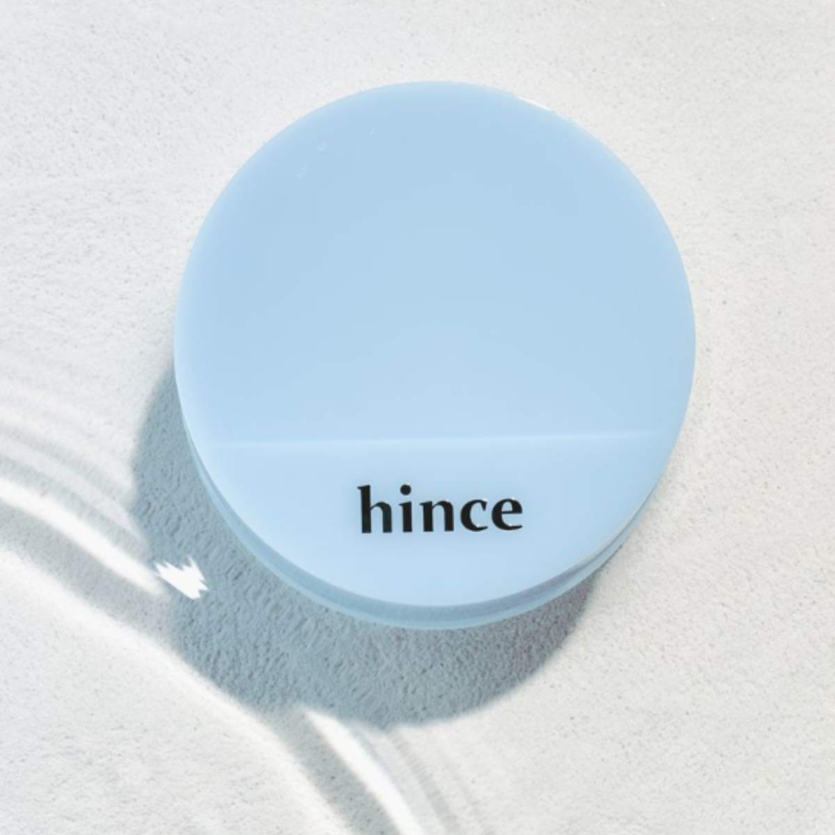 Hince Second Skin Mesh Matte Cushion Foundation in Chill Voyage Edition, close-up of the compact with mesh cover and foundation sponge.