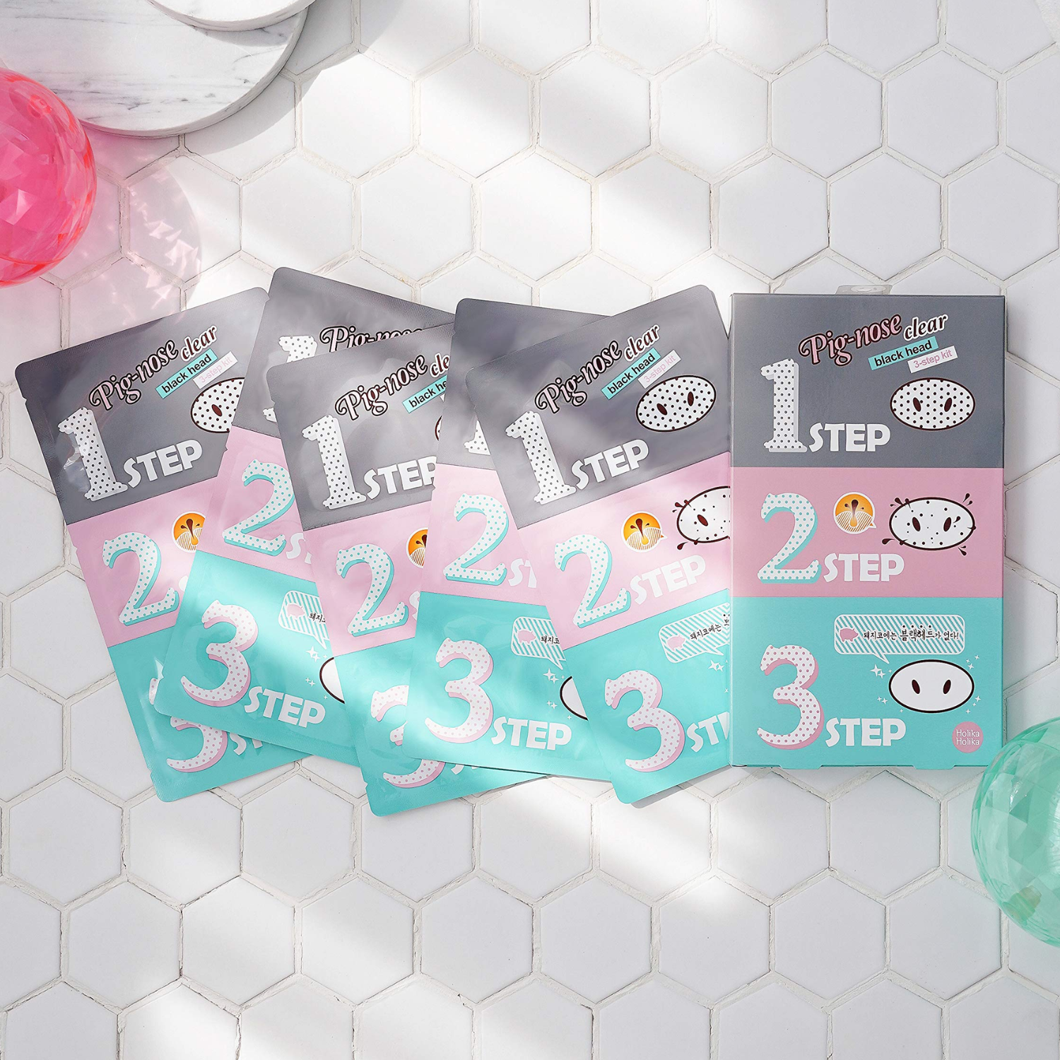 Holika Holika Pig-Clear Black Head 3-Step Kit with exfoliants and scrubs for pore cleansing and blackhead removal.