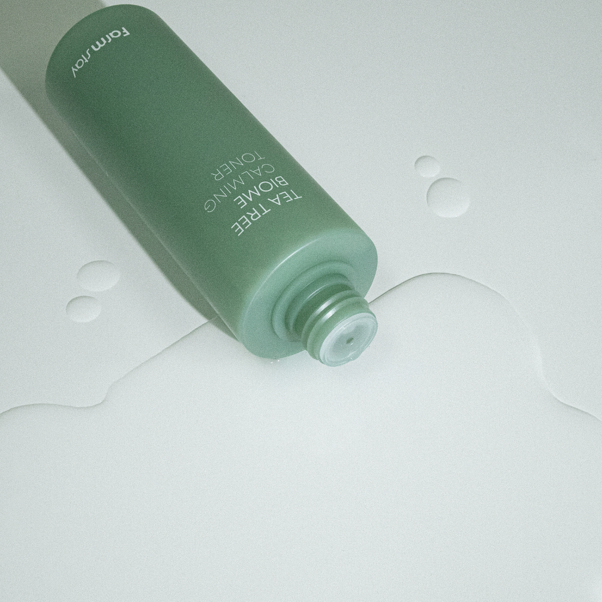 Farmstay Tea Tree Biome Calming Toner 200ml bottle with clear label and green cap, designed for soothing skin.