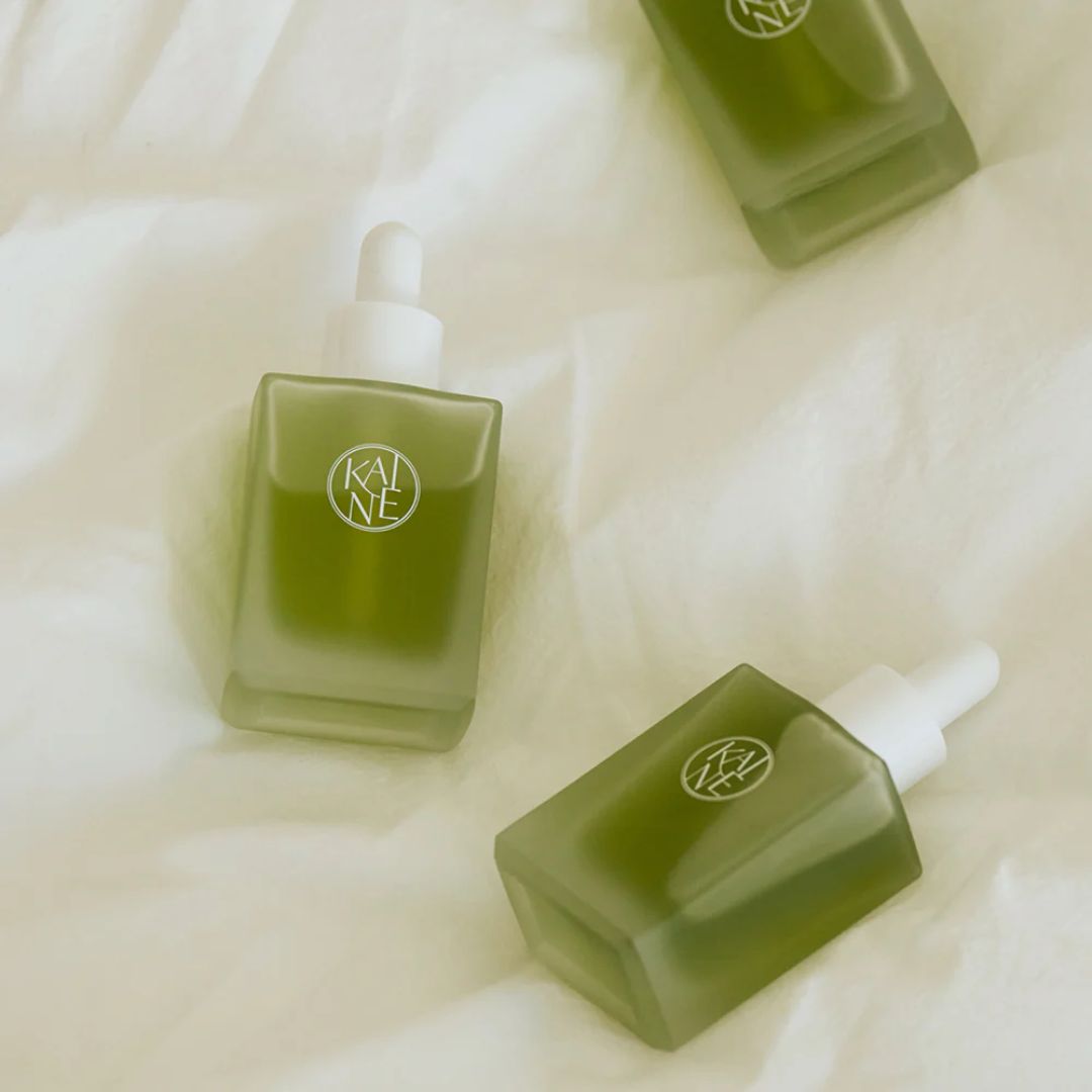 KAINE Rosemary AHA Night Serum 30ml, clear glass bottle with dropper, showcasing the product ready for skincare application.