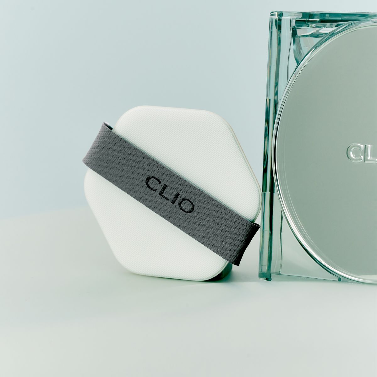 Clio Kill Cover Skin Fixer Cushion Foundation puff, soft makeup applicator for cushion foundation, close-up view.