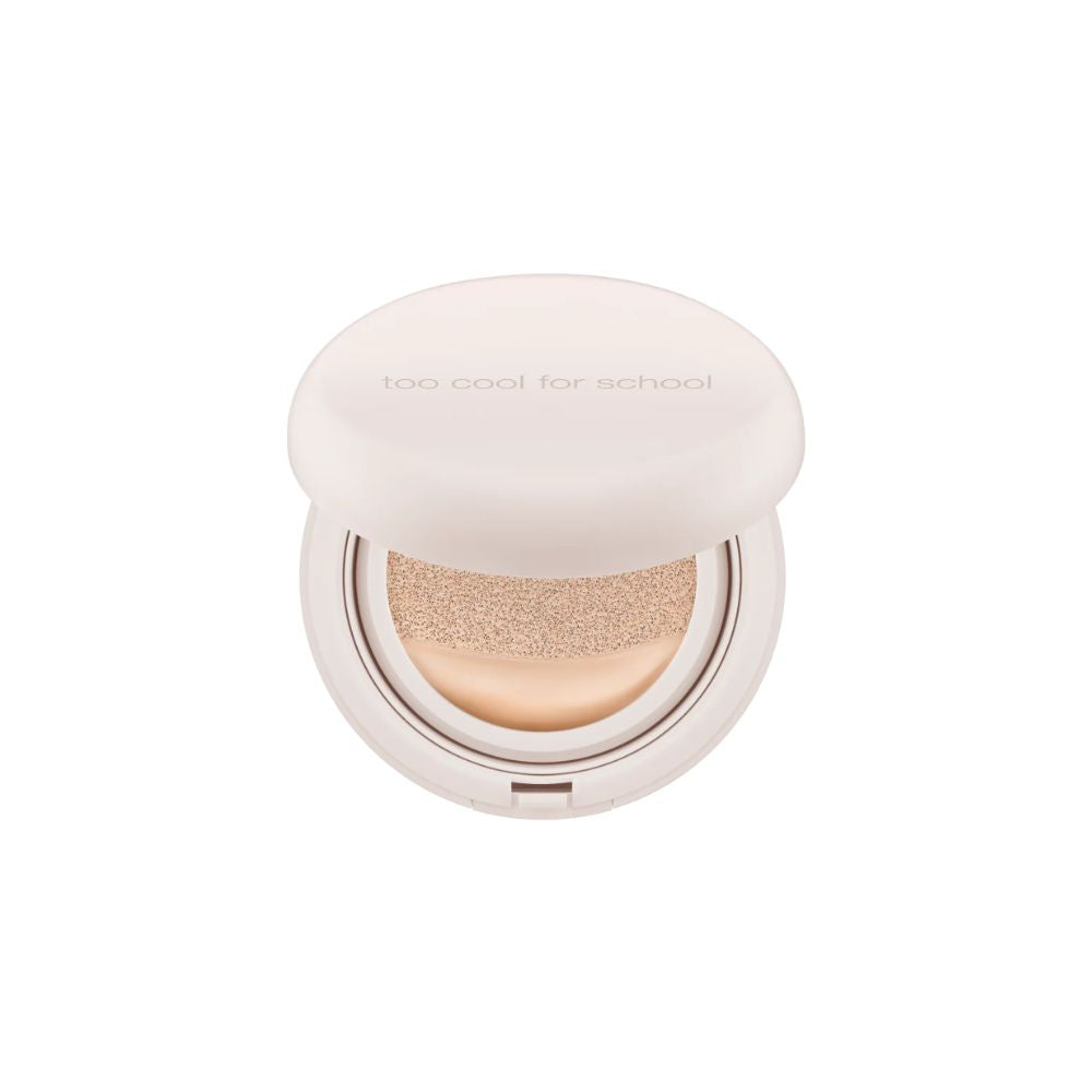 Too Cool For School Fixing Nude Cushion foundation with refill, showing the compact with beige cushion and applicator sponge.