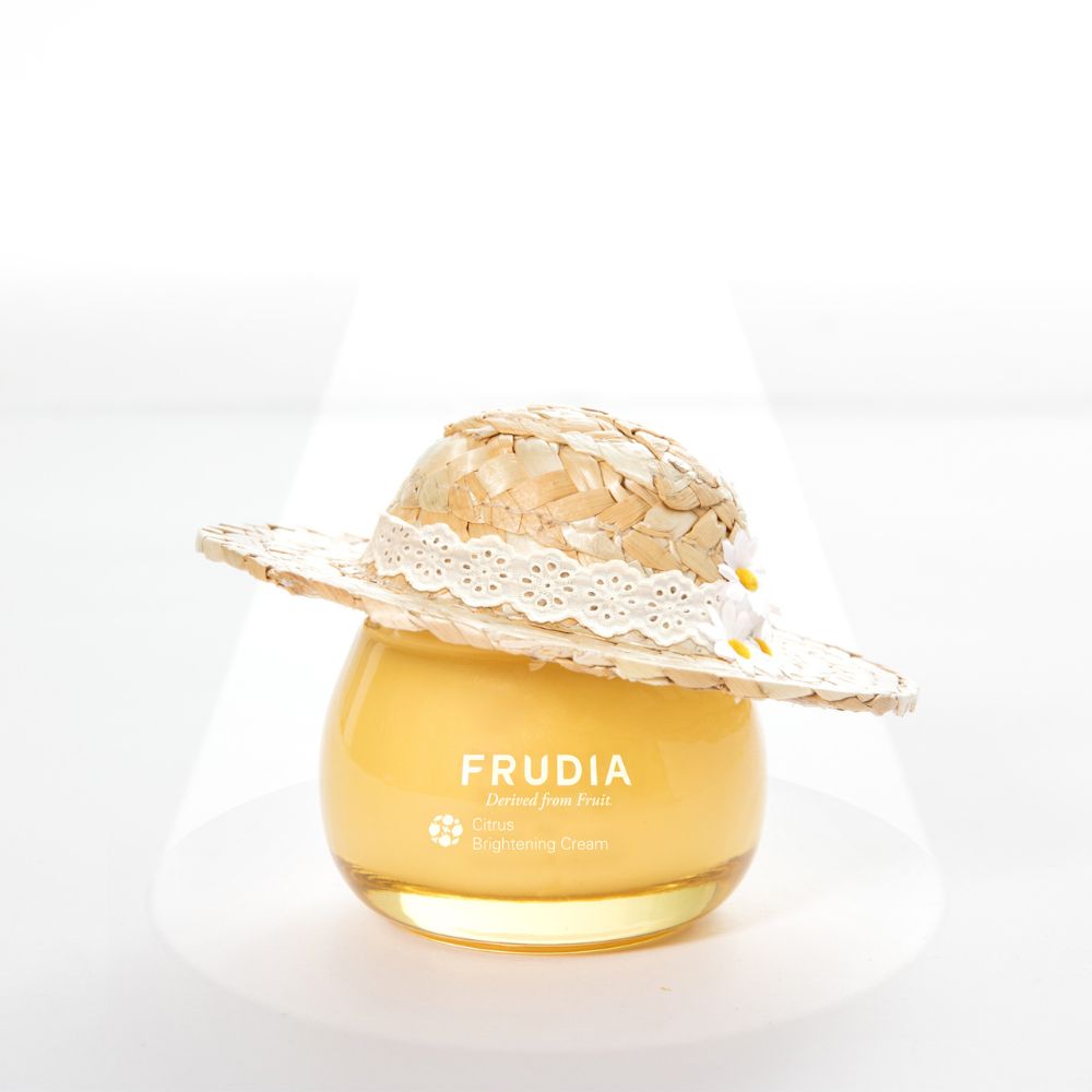 Frudia Citrus Brightening Cream face moisturizer jar with citrus fruit imagery, showcasing brightening skincare benefits.