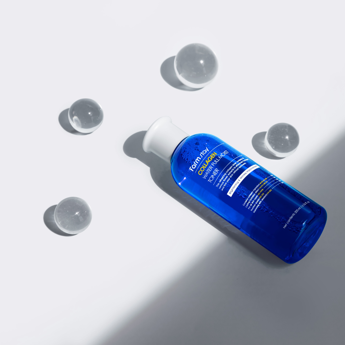 Farmstay Collagen Water Full Moist Toner in a 200ml bottle, featuring clear liquid with a minimalist label and pump dispenser.
