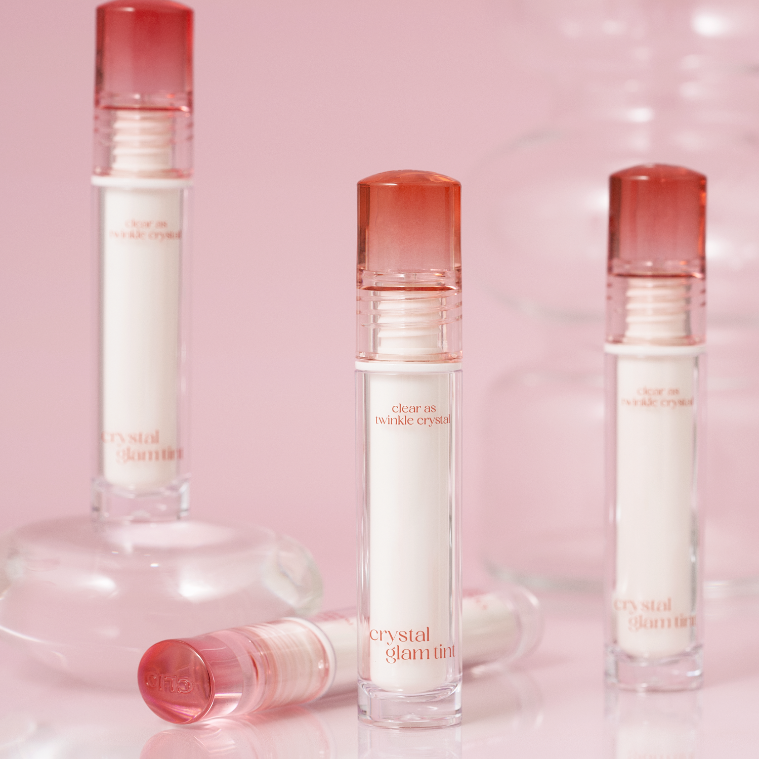 Clio Crystal Glam Lip Tint in a sleek tube, showcasing the shimmering, tinted lip color with a glossy finish.