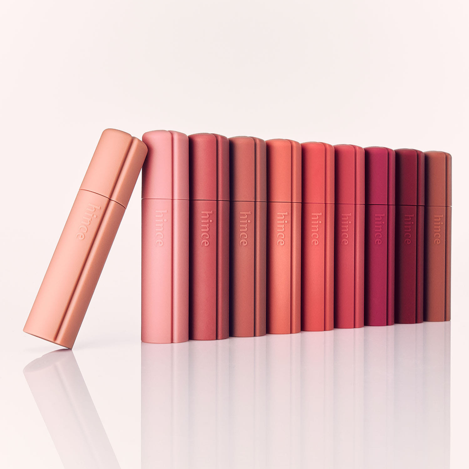 Hince Nu Blur Tint lip tint in a natural shade, showcasing the sleek tube and applicator for a smooth, blurred lip look.
