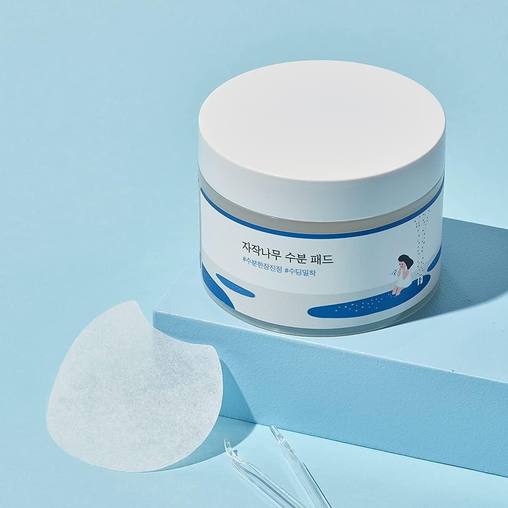 Round Lab Birch Juice Moisturizing Toner Pads, 80pcs, showing a container of soothing, hydrating toner pads for skincare.