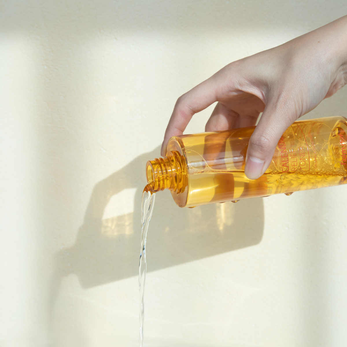 Farmstay Calendula Relief Toner 200ml bottle with natural ingredients and calming floral design on label.
