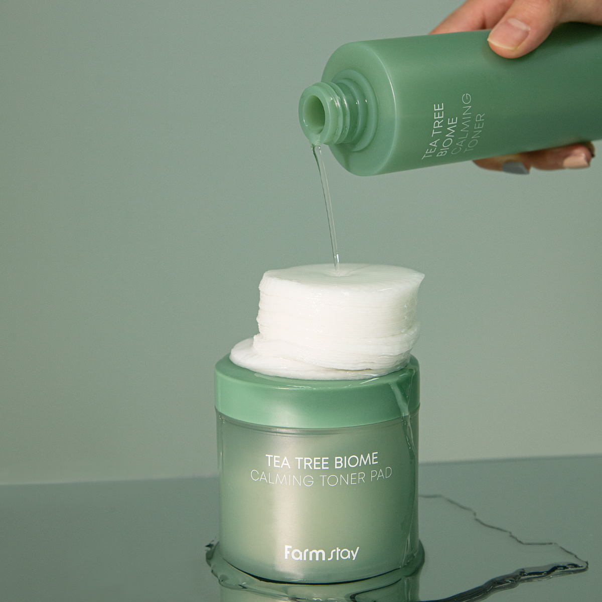 Farmstay Tea Tree Biome Calming Toner Pad 140ml with natural ingredients, soothing and refreshing skincare for sensitive skin.