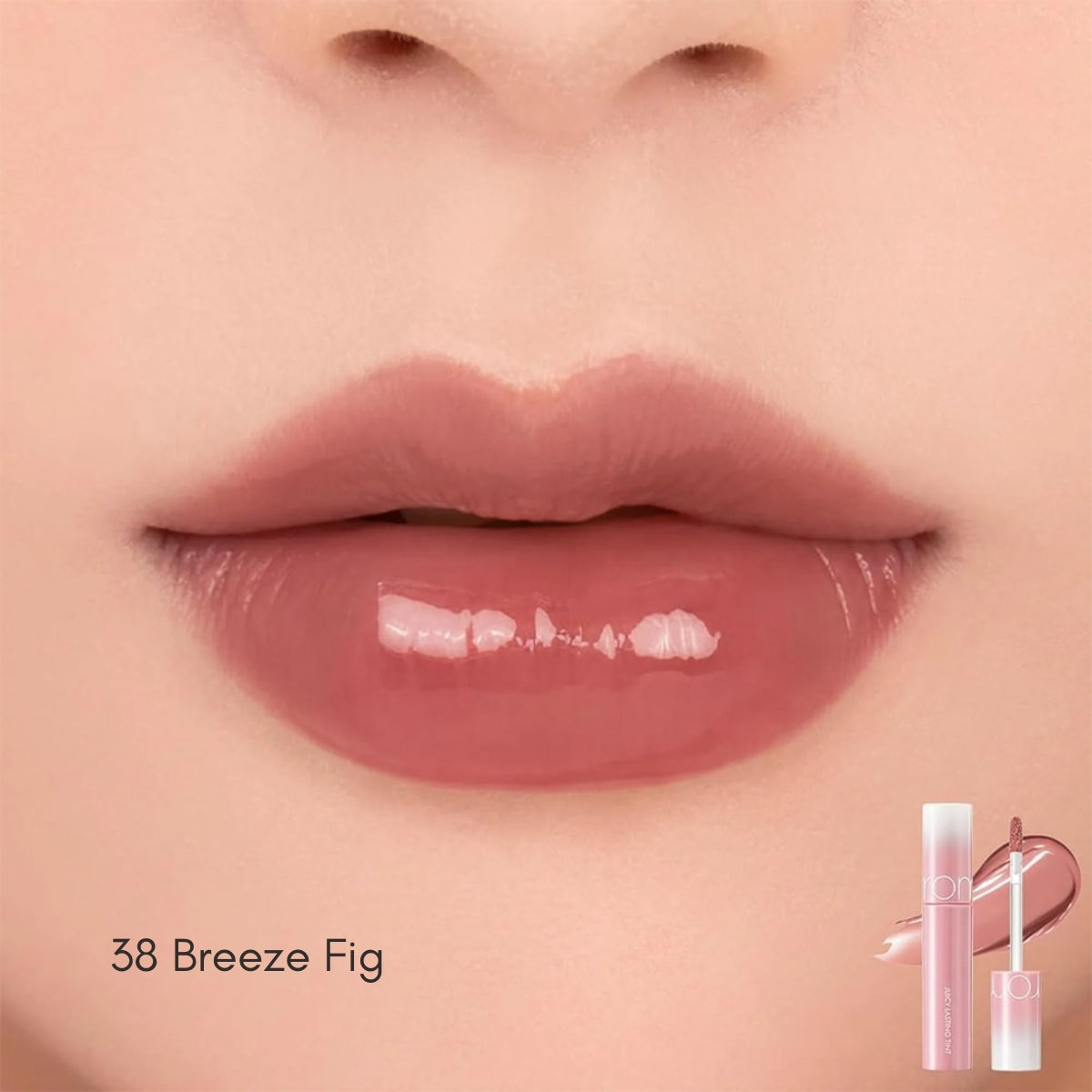 Rom&nd Juicy Lasting Tint lip tint in a vibrant coral shade, showing the product tube and applicator.