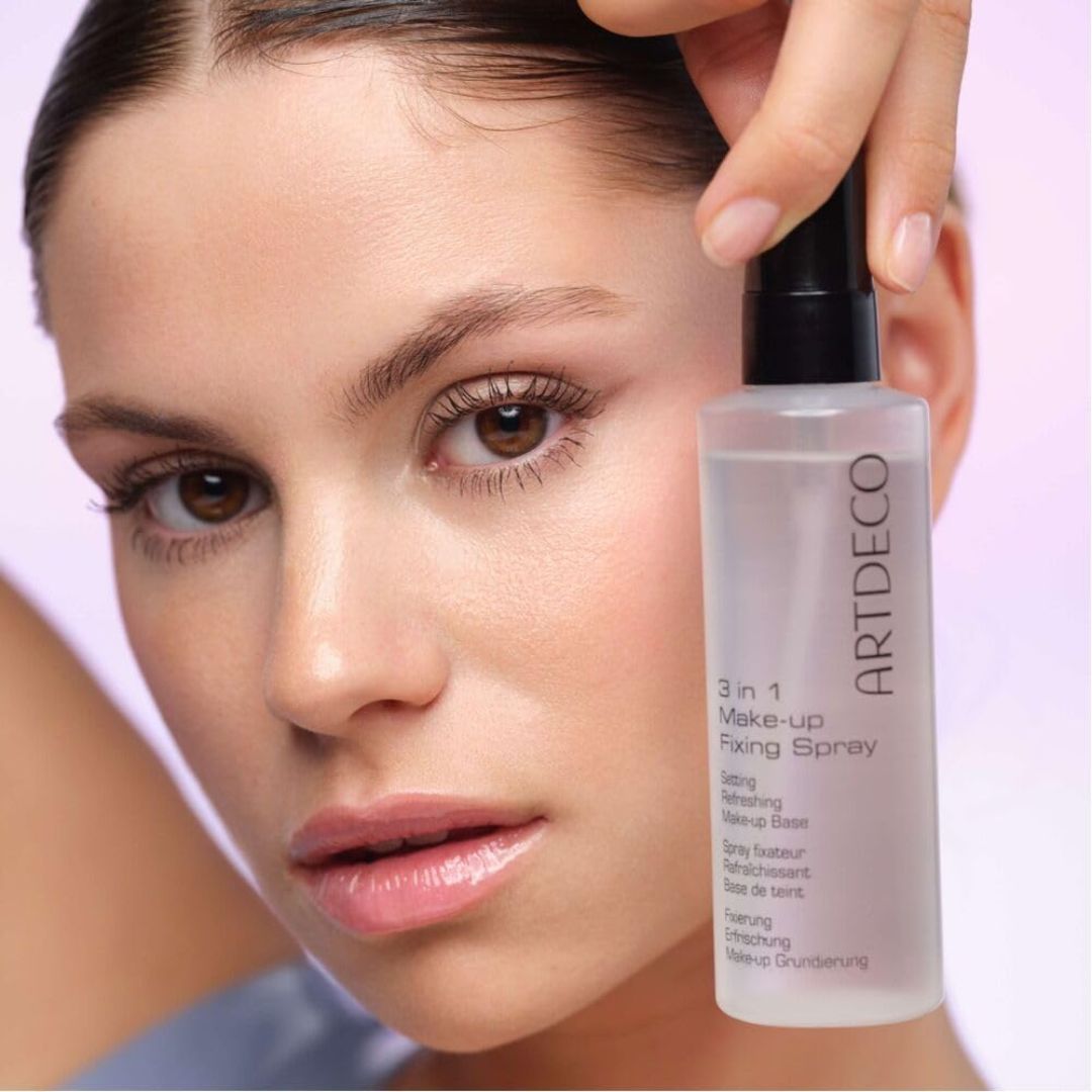ARTDECO 3-in-1 make-up fixing spray in a sleek bottle, designed to set and refresh makeup for a natural, long-lasting look.