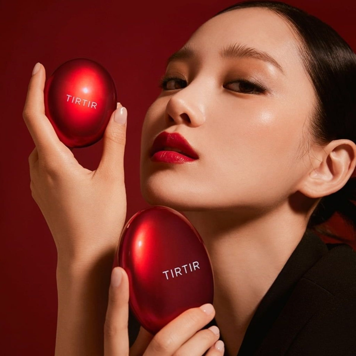 TIRTIR Mask Fit Red Mini Cushion foundation compact with a vibrant red case and open to show the sponge applicator inside.