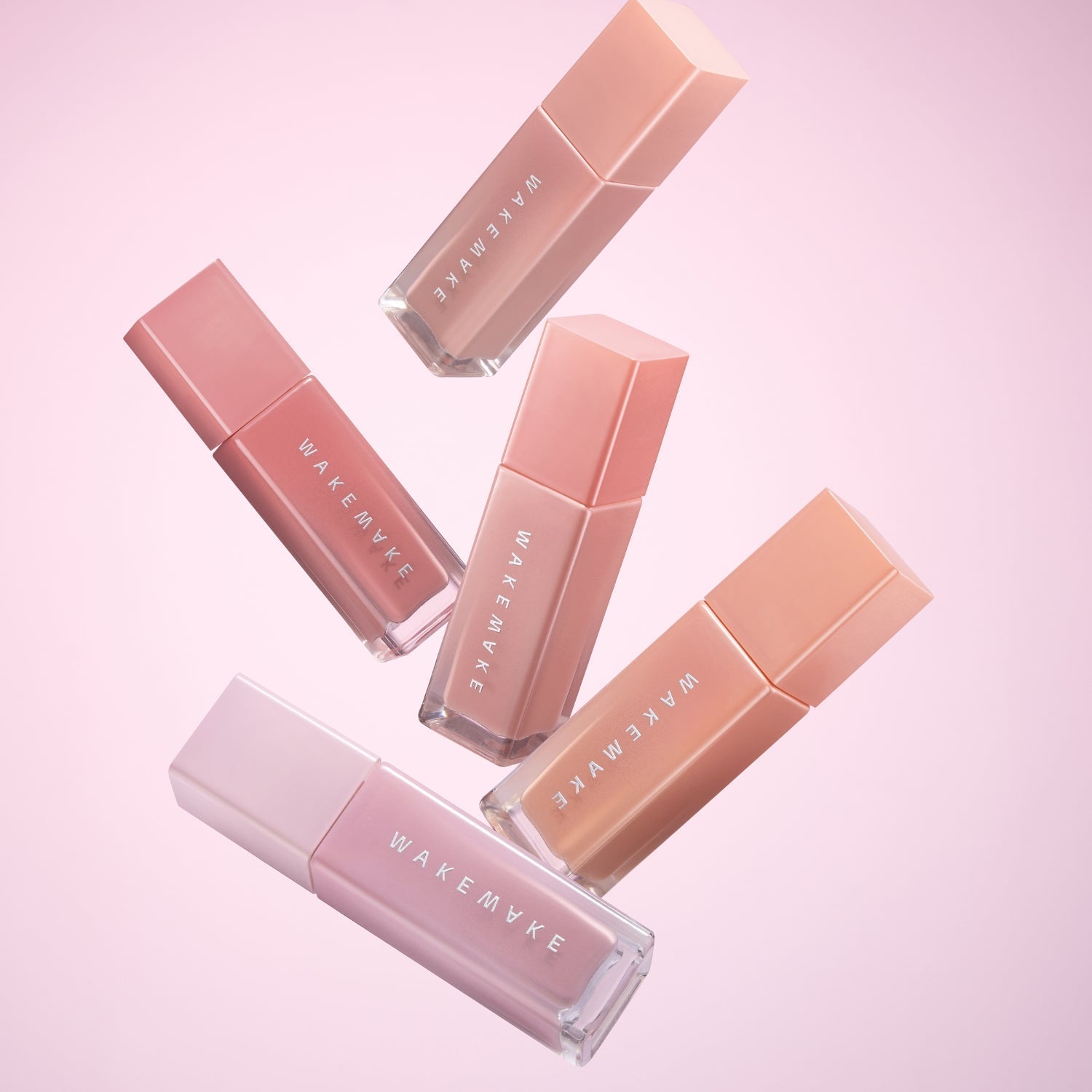 Wakemake Sheer Glow Liquid Blusher in a soft pink shade, showcasing the blush's smooth, luminous liquid formula and natural finish.