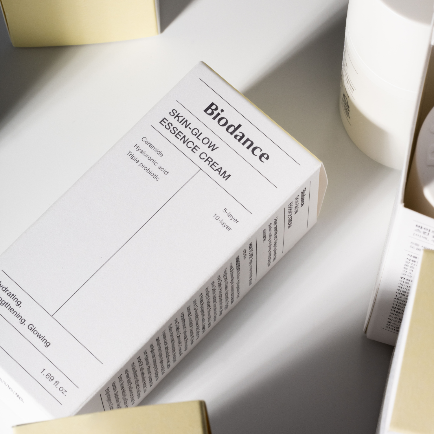 Biodance Skin-Glow Essence Cream 50ml face moisturizer jar with a sleek, transparent container and a white lid.