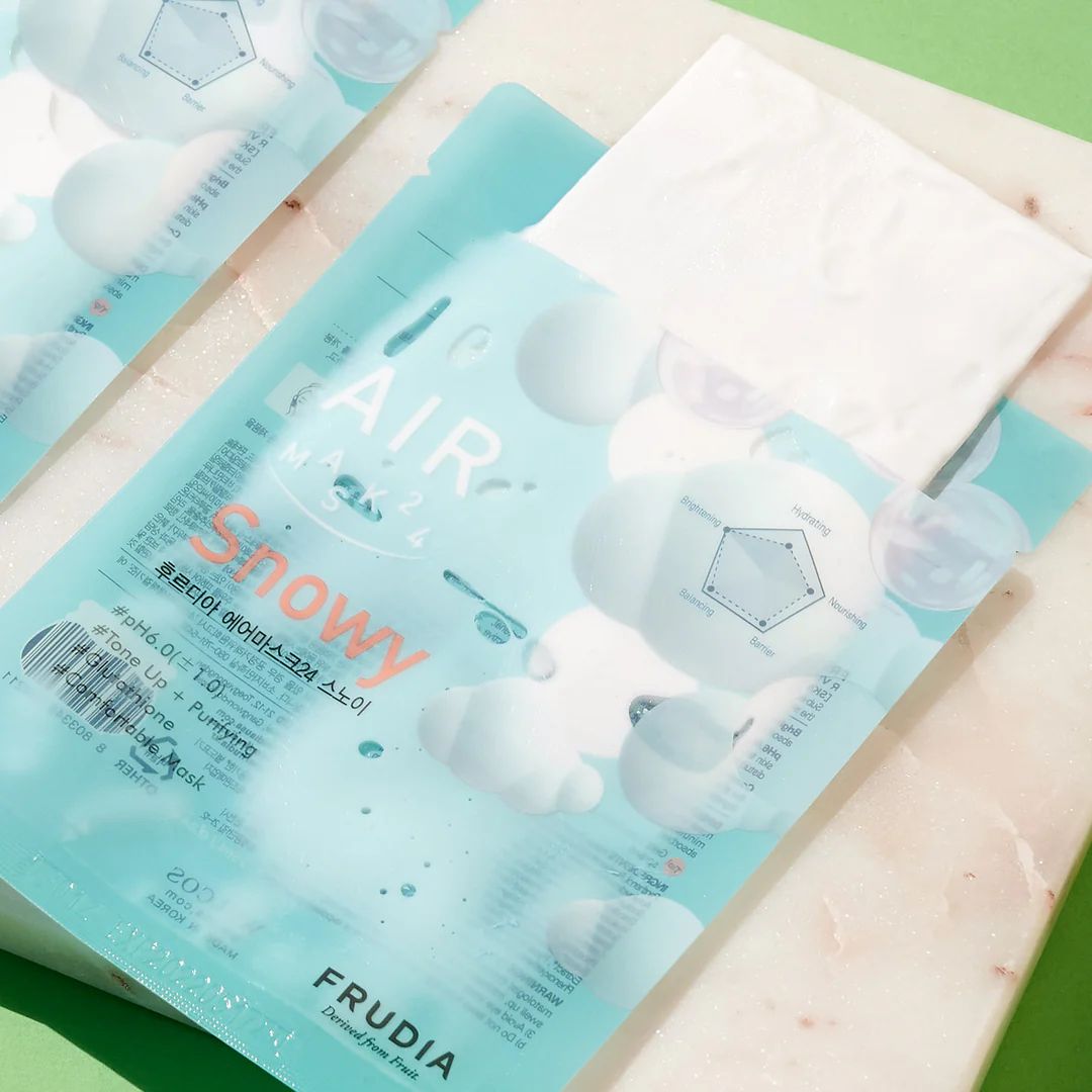 Frudia AIR Mask 24 Snowy sheet mask laid flat, showing the soft, hydrating sheet with snowy-themed packaging for skincare.