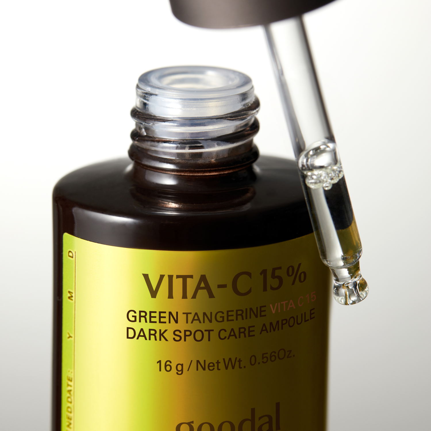 Goodal Green Tangerine Vita C 15 Dark Spot Care Ampoule bottle with vibrant green citrus label and dropper cap.