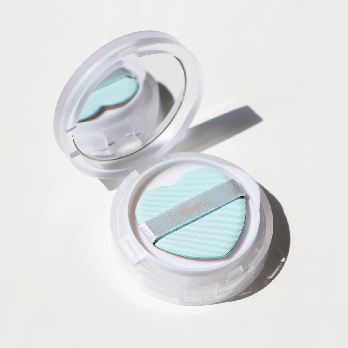 A'pieu Waterlock Finisher setting powder in a compact container with a clear lid, designed to set and mattify makeup.