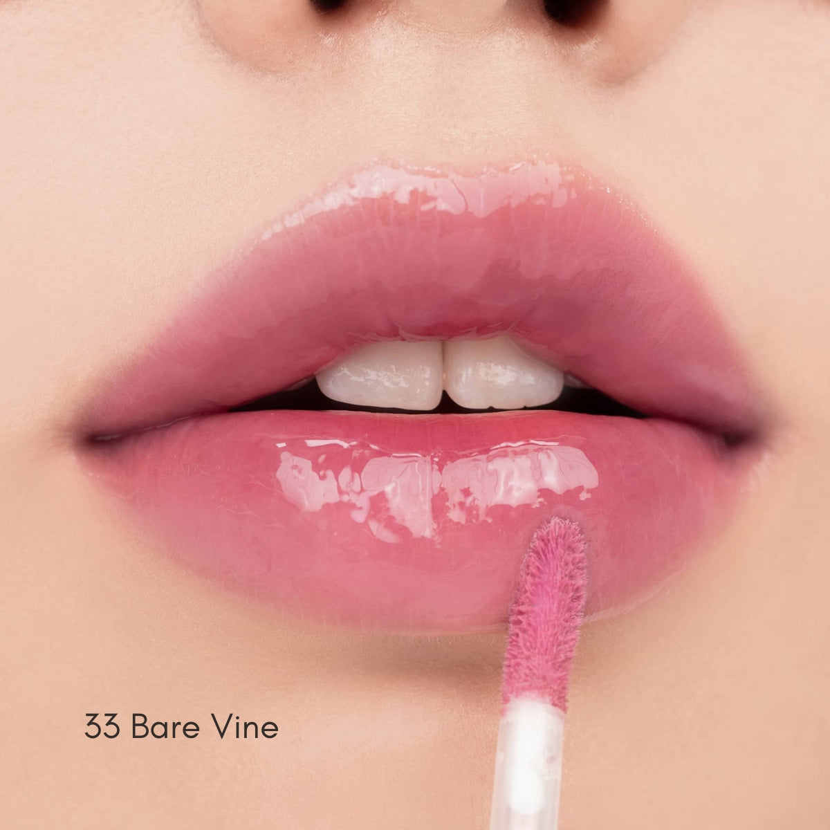 Rom&nd Juicy Lasting Tint lip tint tube with applicator, showing vibrant color and sleek packaging.