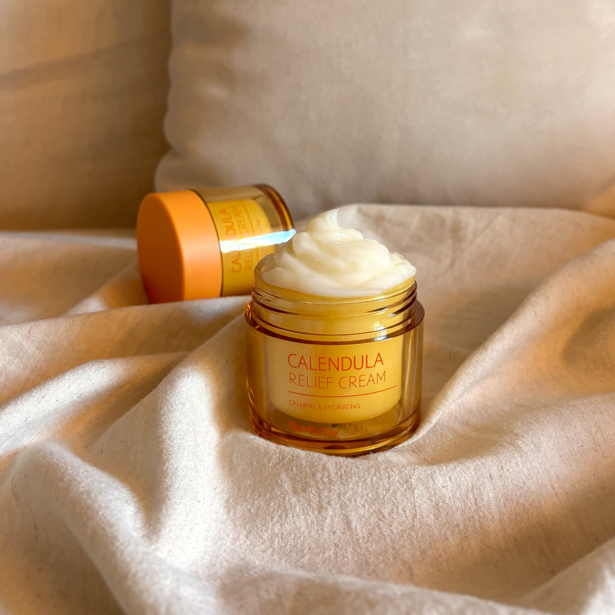 Farmstay Calendula Relief Cream face moisturizer in 80ml jar with calendula extract for soothing skin care.