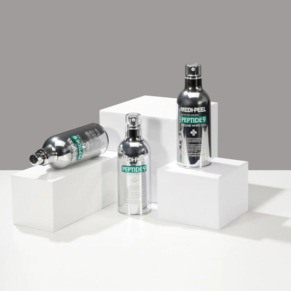 MEDIPEEL+ Peptide 9 Volume White Cica Essence bottle, 100mL, showcasing the clear liquid essence in a sleek bottle.