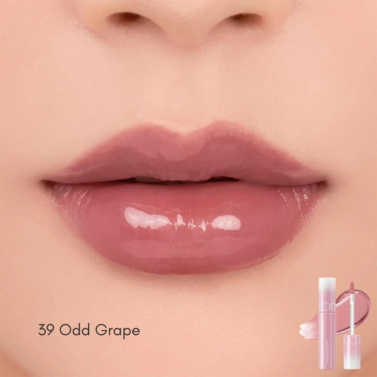 Rom&nd Juicy Lasting Tint lip tint in a sleek tube with a doe-foot applicator, showcasing vibrant lip color.