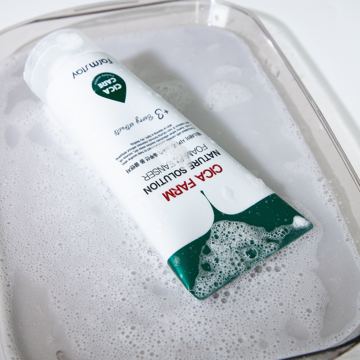 Farmstay Cica Farm Nature Solution Foam Cleanser in a 180ml tube, showing the gel and foam cleanser for gentle skin cleansing.