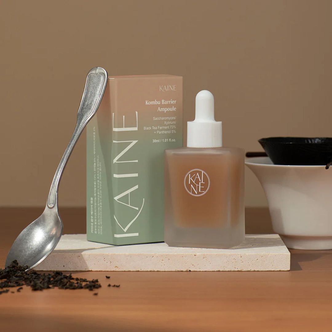 KAINE Kombu Barrier Ampoule 30ml in a clear glass bottle with a dropper cap, showcasing skincare packaging.