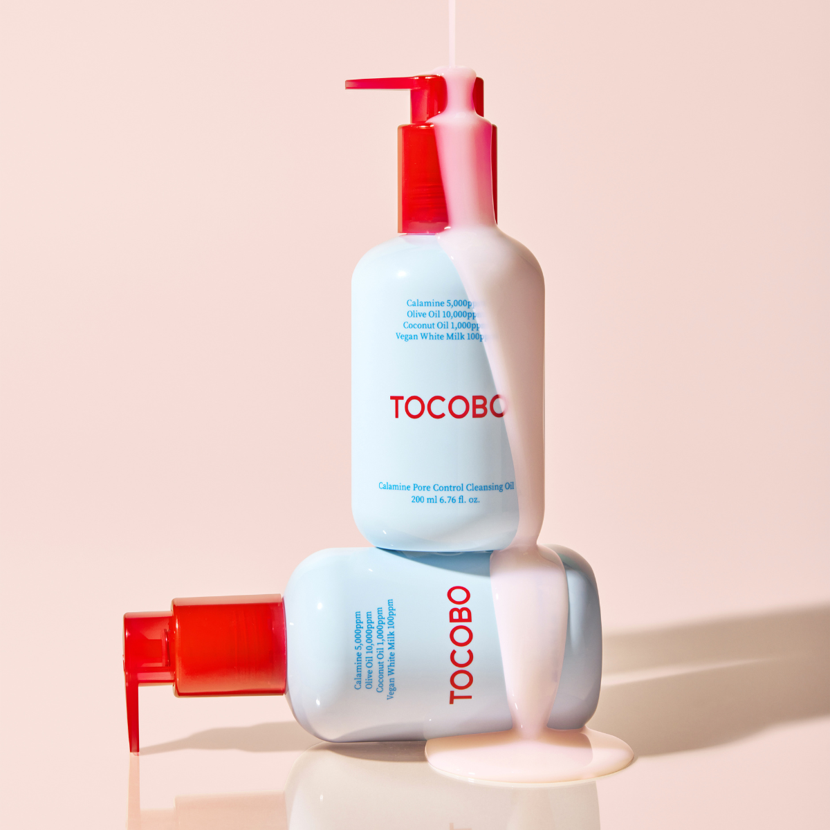 TOCOBO Calamine Pore Control Cleansing Oil in a 200ml bottle, showing the transparent oil with a pump dispenser.
