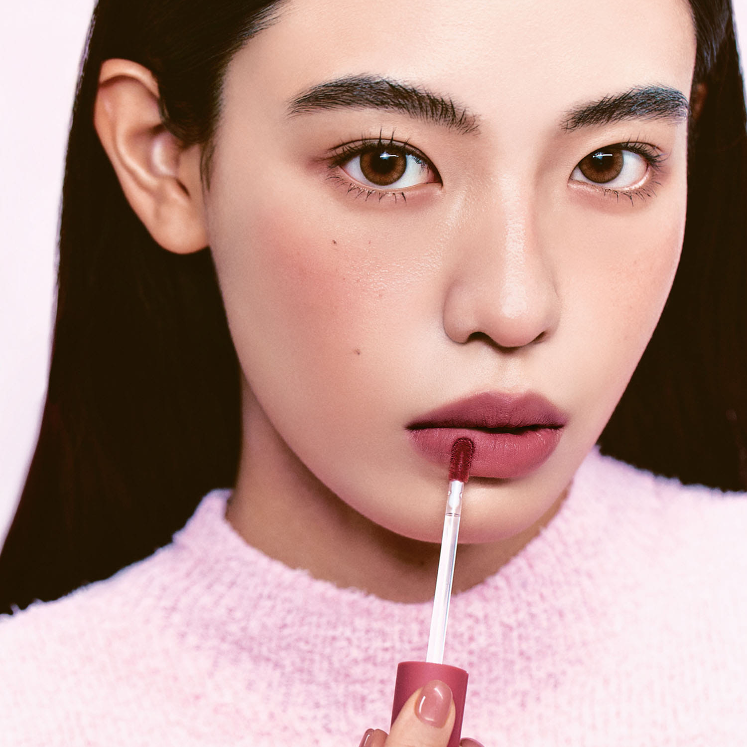 Hince Nu Blur Lip Tint applied on lips showing a natural, matte pink finish with smooth, even color.