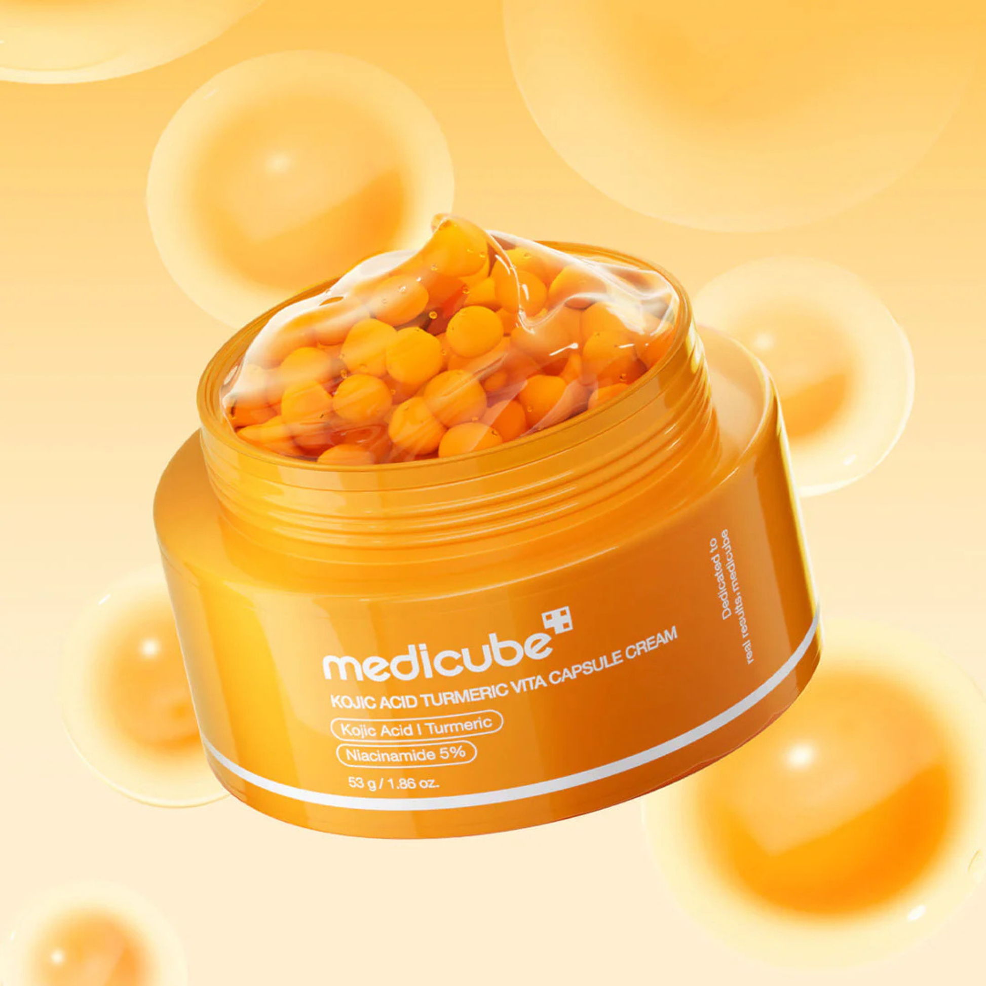 Medicube Kojic Acid Turmeric Vita Capsule Cream face moisturizer in a jar, showing the cream's smooth texture and packaging.