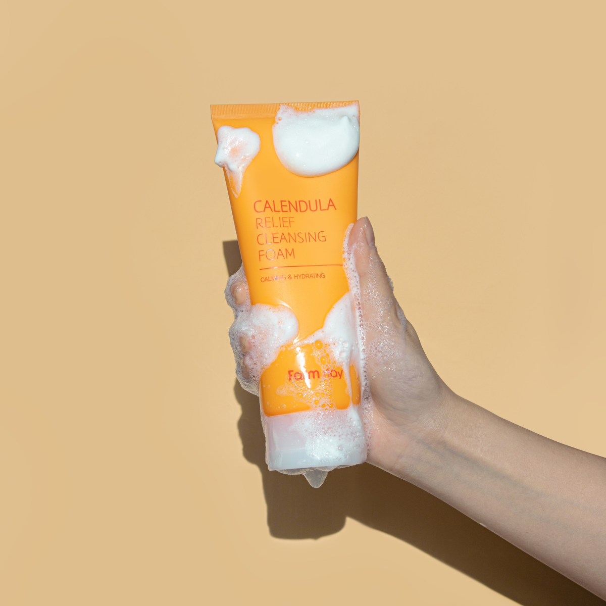 Farmstay Calendula Relief Cleansing Foam in 180ml gel and foam cleanser bottle, gentle skincare for soothing skin.