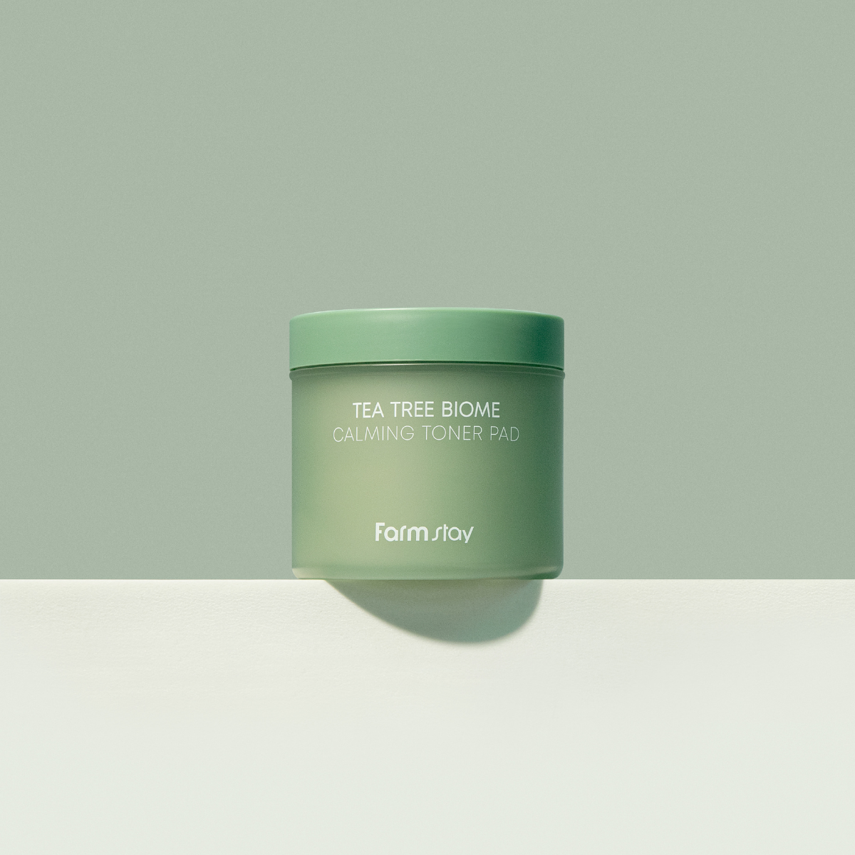 Farmstay Tea Tree Biome Calming Toner Pad 140ml showing the packaging and product pads for soothing skincare.
